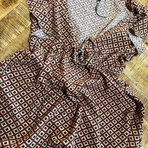 Never worn. Vneck, low cut. Adorable printed dress